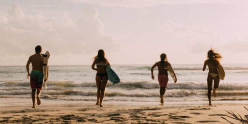 Teens bonding over surfing, enjoying waves, and exploring together